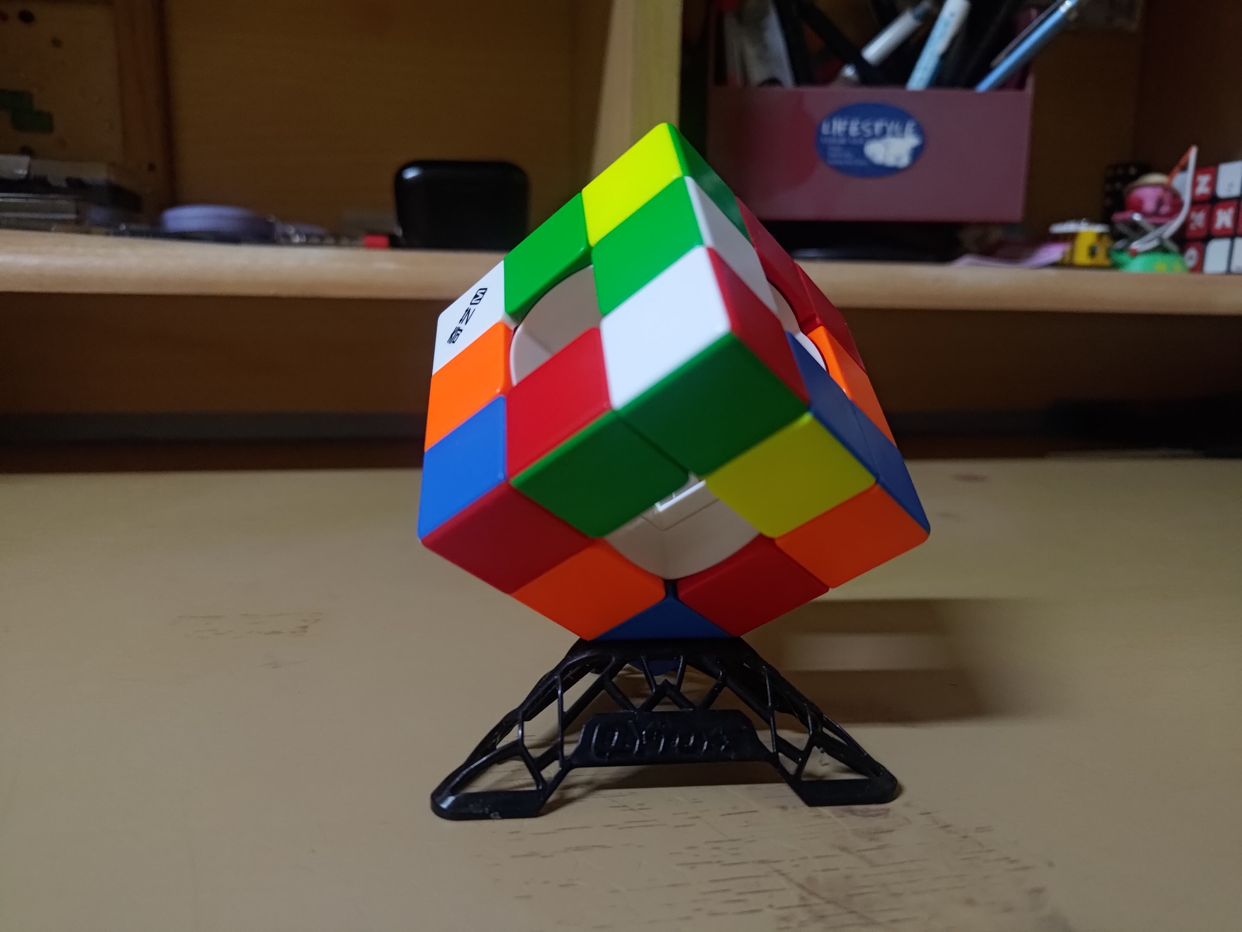Qiyi void cube scrambled & on a stand